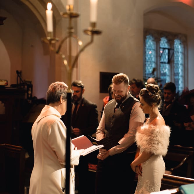 Christmas Pub Wedding At The Falcon Rotherwick With Bride In Alice By Watters And Candle Lit Wedding Ceremony Images By Rebecca Searle Photography