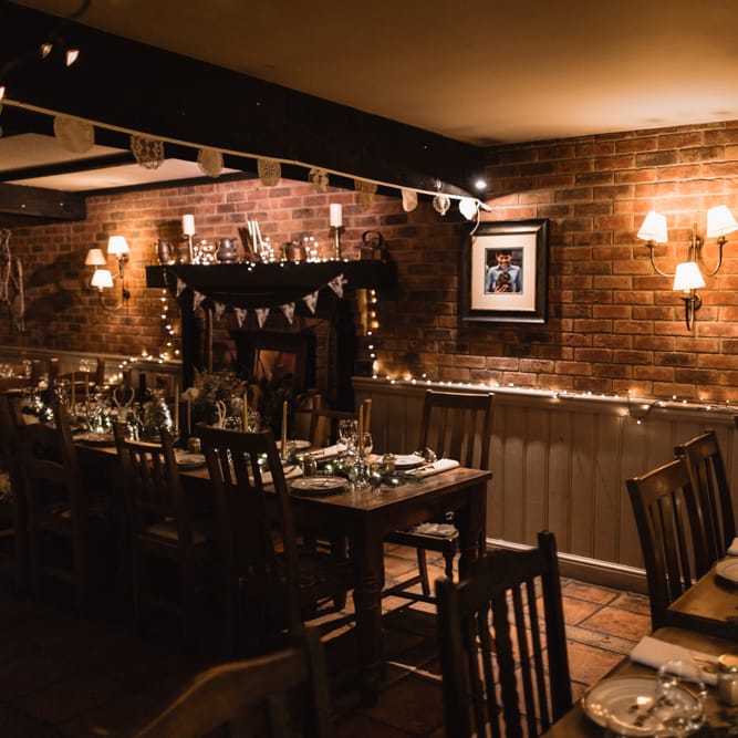 Christmas Pub Wedding At The Falcon Rotherwick With Bride In Alice By Watters And Candle Lit Wedding Ceremony Images By Rebecca Searle Photography