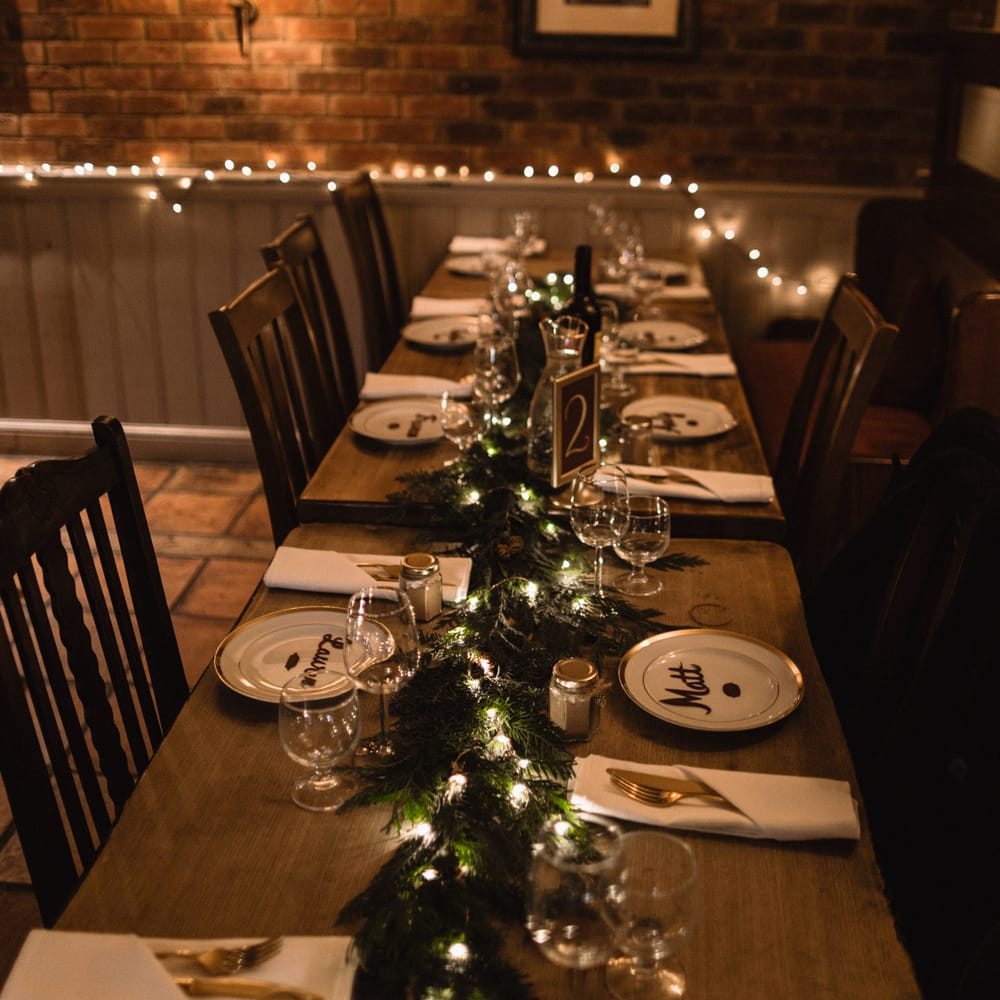 Christmas Pub Wedding At The Falcon Rotherwick With Bride In Alice By Watters And Candle Lit Wedding Ceremony Images By Rebecca Searle Photography