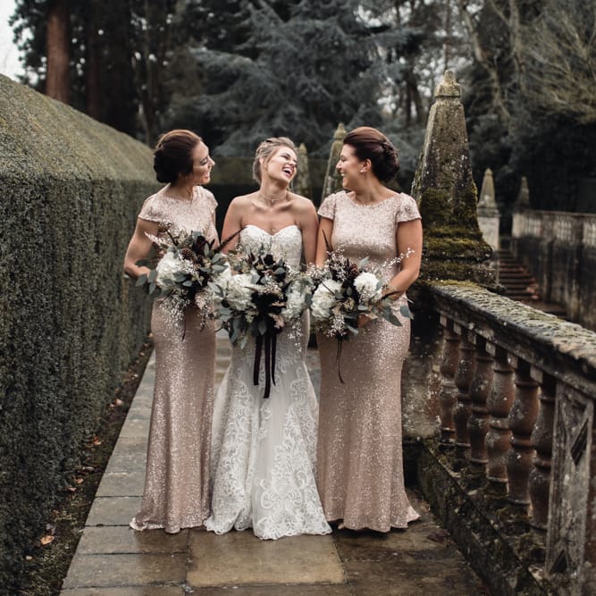 Bride &amp; Bridesmaids In Winter Wedding Attire // Bride In Alice Dress By Watters // Christmas Pub Wedding At The Falcon Rotherwick With Bride In Alice By Watters And Candle Lit Wedding Ceremony Images By Rebecca Searle Photography