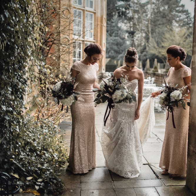 Bride &amp; Bridesmaids In Winter Wedding Attire // Bride In Alice Dress By Watters // Christmas Pub Wedding At The Falcon Rotherwick With Bride In Alice By Watters And Candle Lit Wedding Ceremony Images By Rebecca Searle Photography