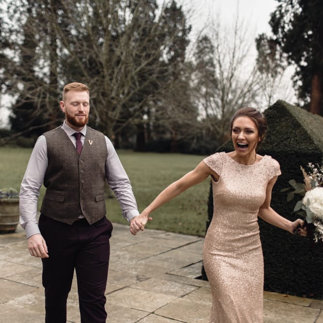 Bridesmaids Walking With Groom For 'First Look' At The Bride // Bride In Alice Dress By Watters // Christmas Pub Wedding At The Falcon Rotherwick With Bride In Alice By Watters And Candle Lit Wedding Ceremony Images By Rebecca Searle Photography