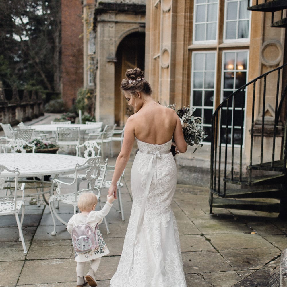 Bride In Alice By Watters With Daughter In Zara Baby // Christmas Pub Wedding At The Falcon Rotherwick With Bride In Alice By Watters And Candle Lit Wedding Ceremony Images By Rebecca Searle Photography