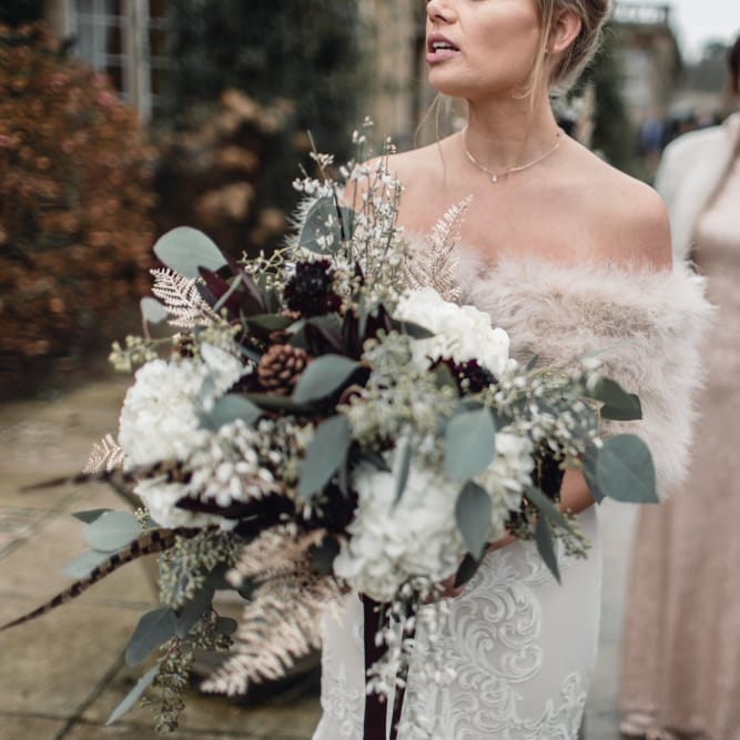 Winter Wedding Bouquet // Christmas Pub Wedding At The Falcon Rotherwick With Bride In Alice By Watters And Candle Lit Wedding Ceremony Images By Rebecca Searle Photography