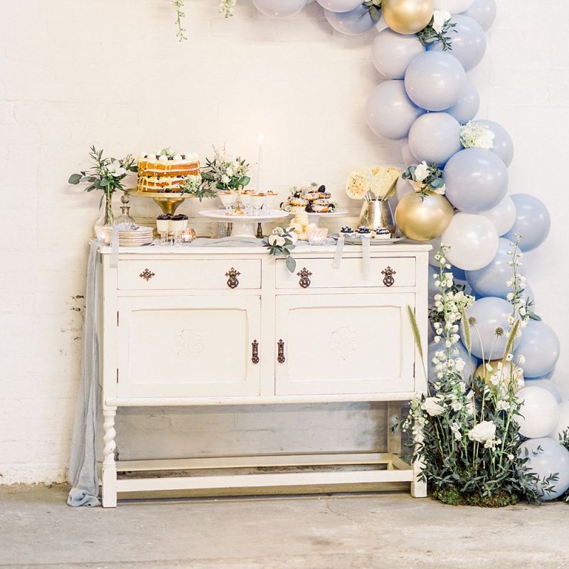 Vintage Dresser &amp; Balloon Back Drop Cake Table for Powder Blue &amp; Luxury Gold Wedding Inspiration Planned &amp; Styled by Hayley Jayne Weddings &amp; Events and Photographed by Terri &amp; Lori Fine Art Photography &amp; Film Studio
