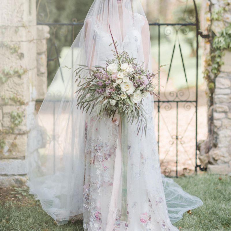 Bride in Stephanie Allin Floral Wedding Dress  and Megan Therese Couture Tulle Wedding Veil