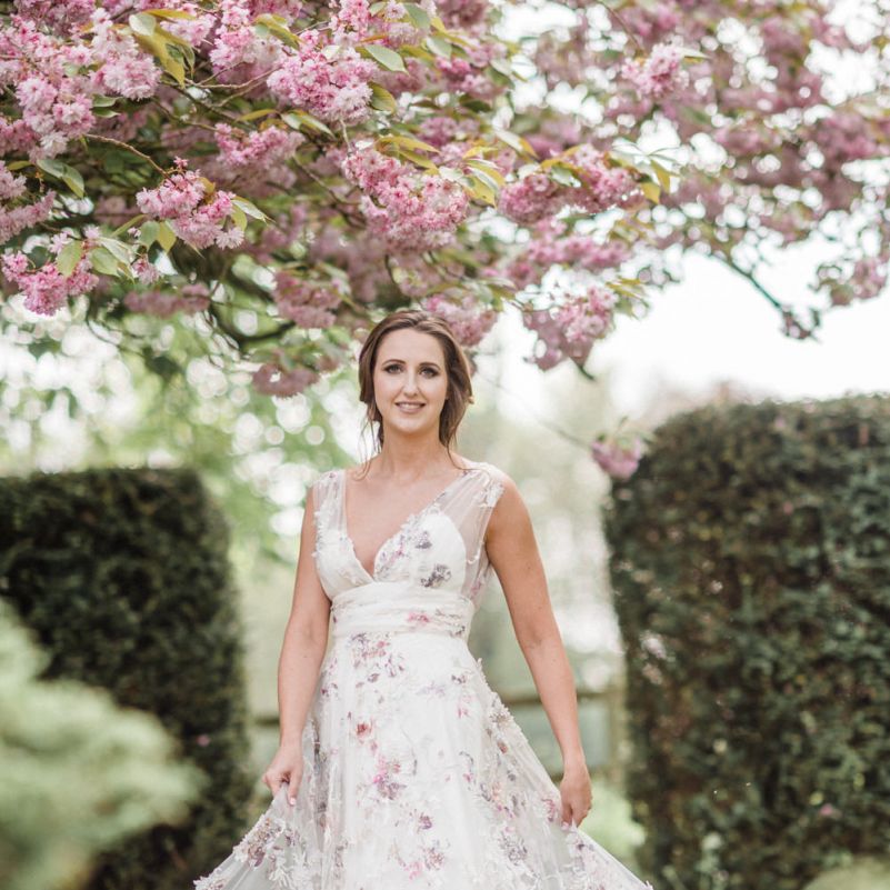 Beautiful Bride Twirling in a Floral Wedding Dress