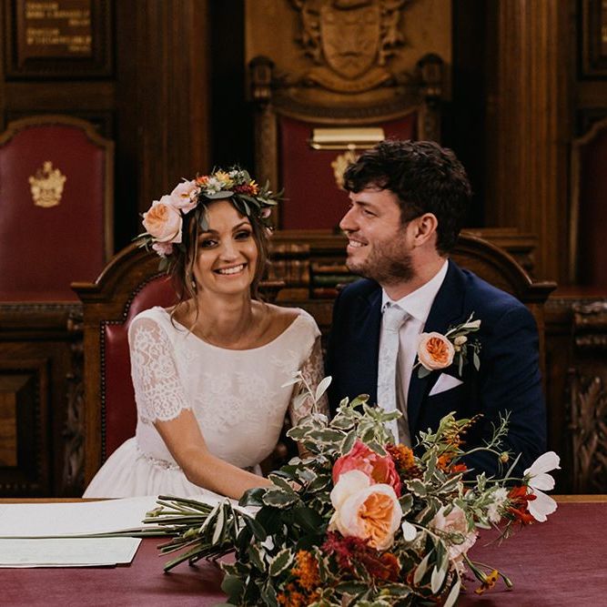 Bride and groom sign the wedding register