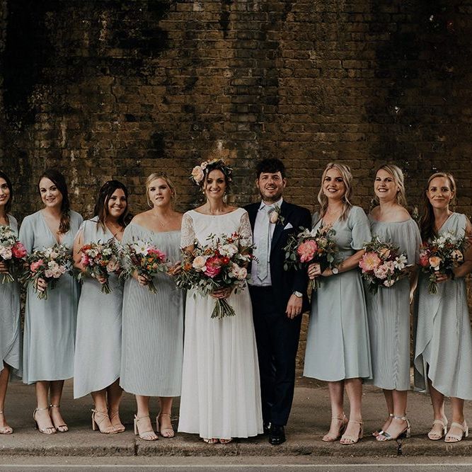 Bridal party in blue mismatched bridesmaid dresses for Islington town hall wedding