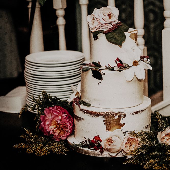 Beautiful tiered wedding cake with floral decor