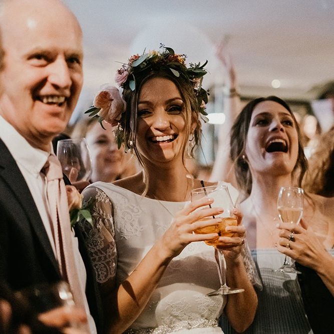 Bride enjoys a drink with guests