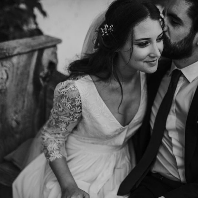 Bride in Donatelle Godart Wedding Dress &amp; Groom in De Fursac Suit Embracing