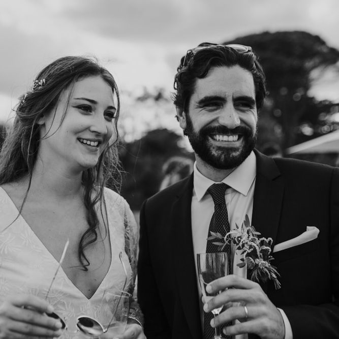 Bride in Donatelle Godart Wedding Dress &amp; Groom in De Fursac Suit  Smiling
