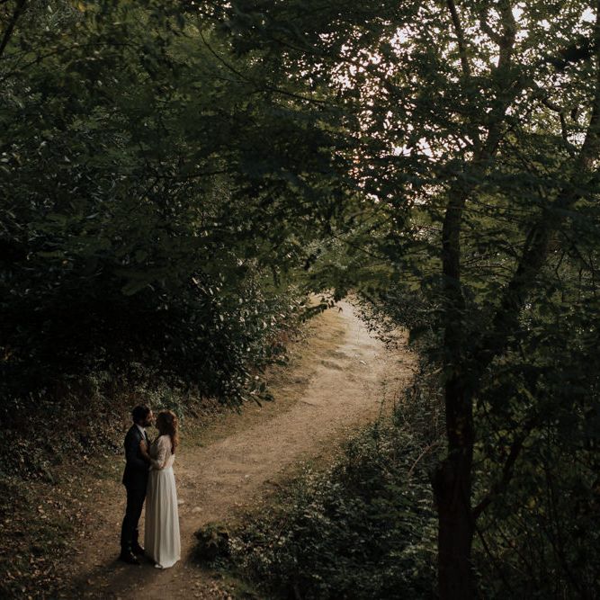 Bride in Donatelle Godart Wedding Dress &amp; Groom in De Fursac Suit