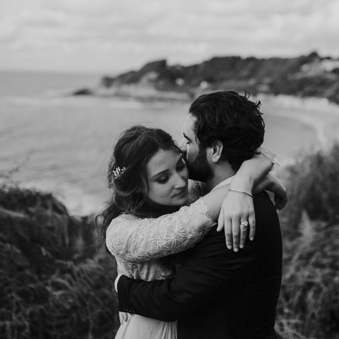 Coastal Portrait of Bride in Donatelle Godart Wedding Dress &amp; Groom in De Fursac Suit