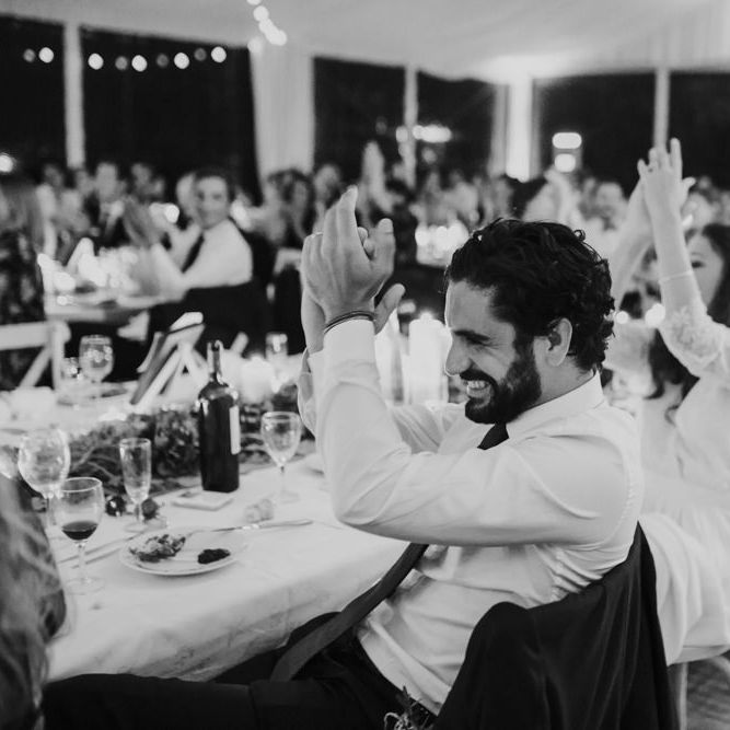 Groom in De Fursac Suit Clapping During Evening Reception