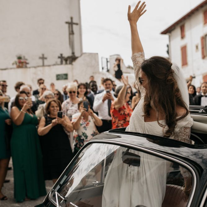 Bride in Donatelle Godart Wedding Dress Waving out of a Fiat 500 Sun Roof