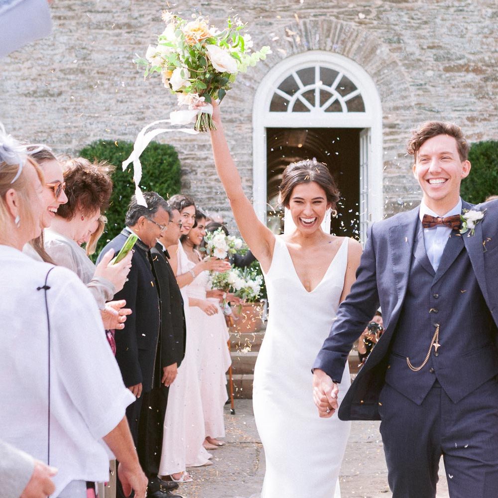 Bride and Groom confetti exit from ceremony