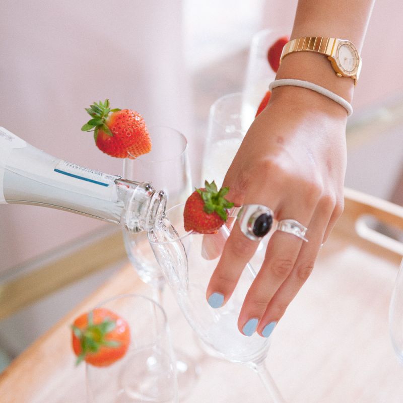 Pouring champagne during preparations at Shilstone House wedding