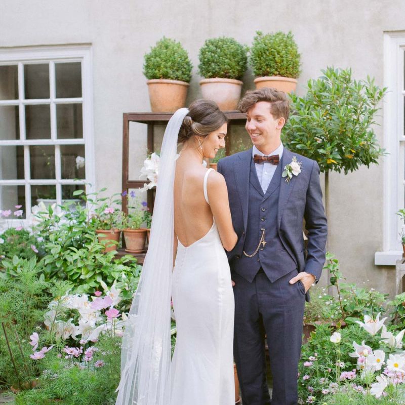 Simple Made With Love bride dress with open back and long veil
