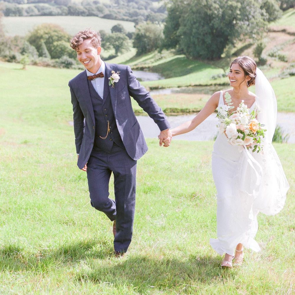Groom in navy suit and bowtie at Shilstone House wedding