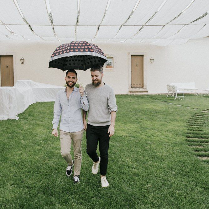 Grooms arrive at wedding venue