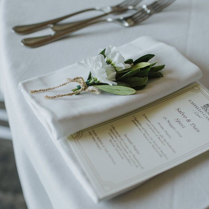 Wedding place setting with olive branch