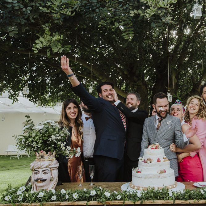 Grey groom suit for grooms celebrating with guests