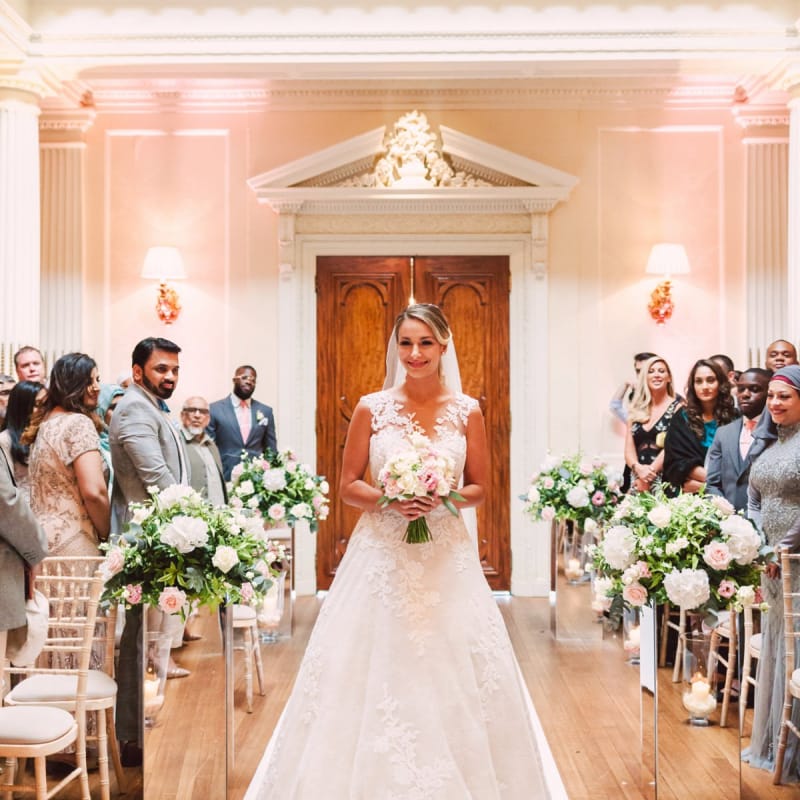 Bride Walking Down the Aisle Alone in a Lace Pronovias Wedding Dress