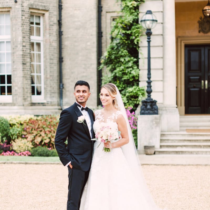 Bride in Lace Pronovias Wedding Dress and Groom in Black Tie Suit