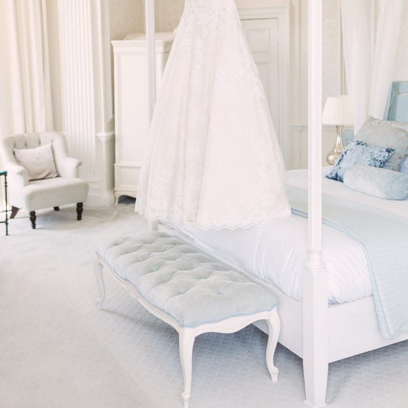 Lace Princess Style Pronovias Wedding Dress Hanging Up in the Bridal Suite on the Morning of the Wedding