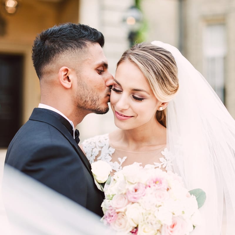 Groom Kissing His Bride