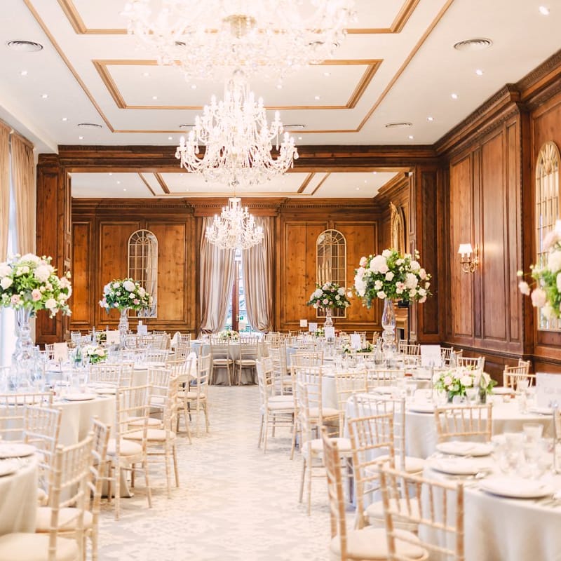 Header House, Buckinghamshire Wedding Reception with Chandelier and Tall Floral Centrepieces