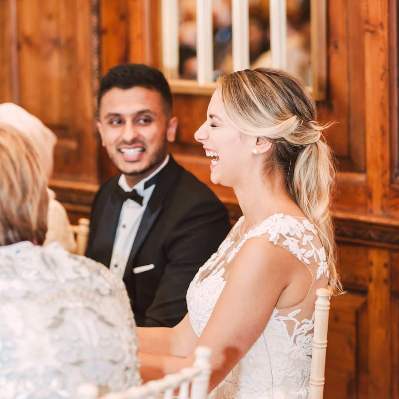 Bride and Groom Laughing During The Wedding Reception Speeches