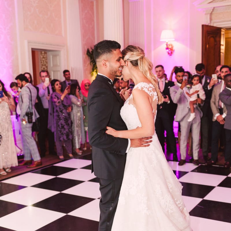 Bride and Groom Enjoying Their First Dance Together