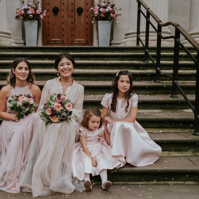 Bridal party at intimate London wedding with bride in tulle skirt
