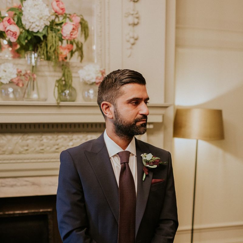 Groom in navy suit at town hall wedding