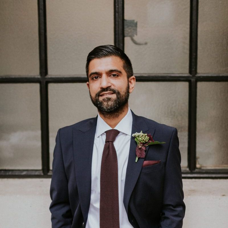 Groom in navy suit and burgundy tie at Town Hall wedding