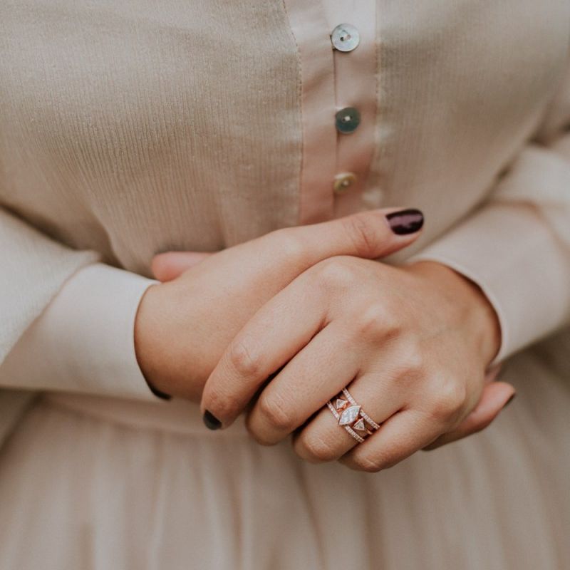 Ornate wedding ring and burgundy wedding nails
