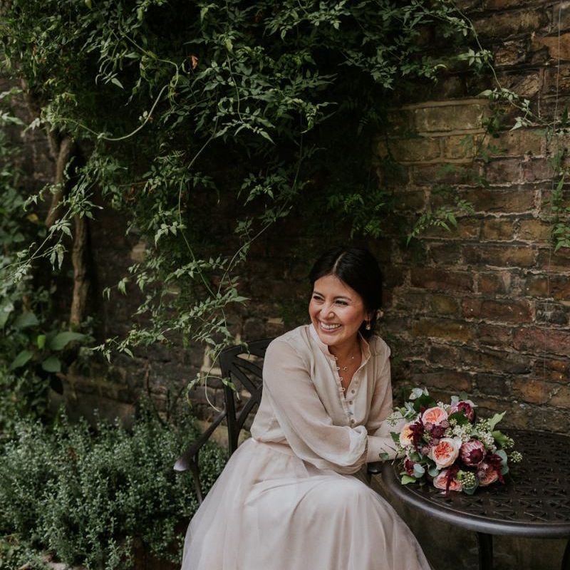 Bride sitting at a table in a tulle skirt