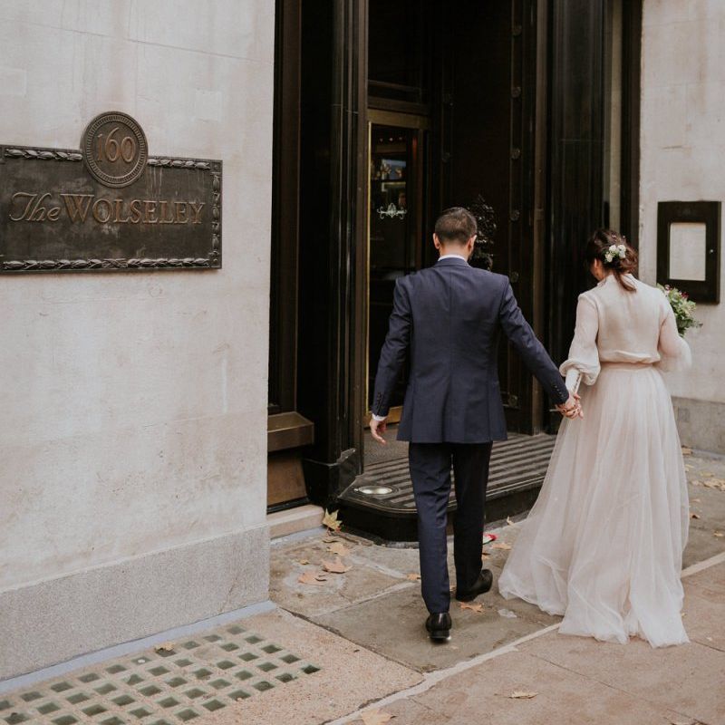Bride and groom entering their intimate wedding reception venue