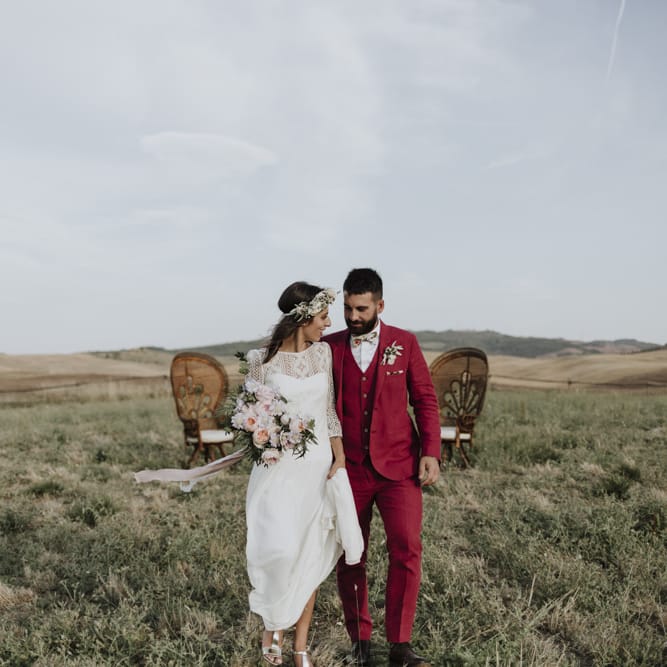 Red wedding suit for groom with Laure de Sagazan bride dress