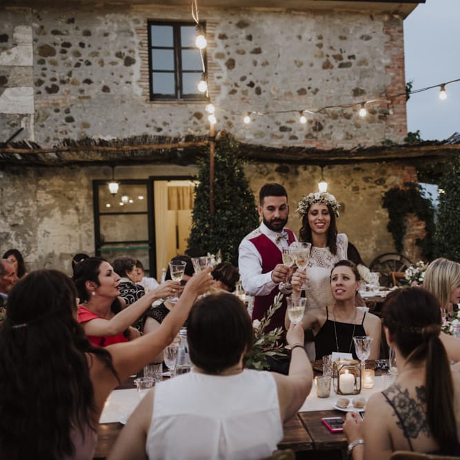Festoon lighting for outdoor wedding dinner