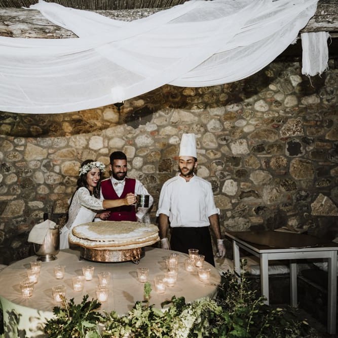 Bride and groom cut the wedding cake