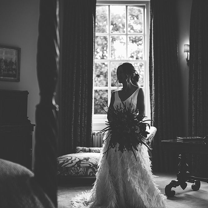 Black &amp; White Portrait of Bride on Wedding Morning in her Charlie Brear Payton Bridal Gown &amp; Piora Feather Skirt