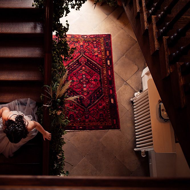 Bridesmaid Walking Down The Stair at Iscoyd Park Wedding Venue