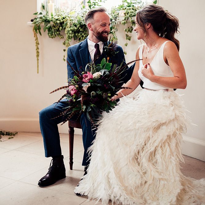 Bride in Charlie Brear Payton Bridal Gown &amp; Piora Feather Skirt and Groom in Three Piece Wool Suit