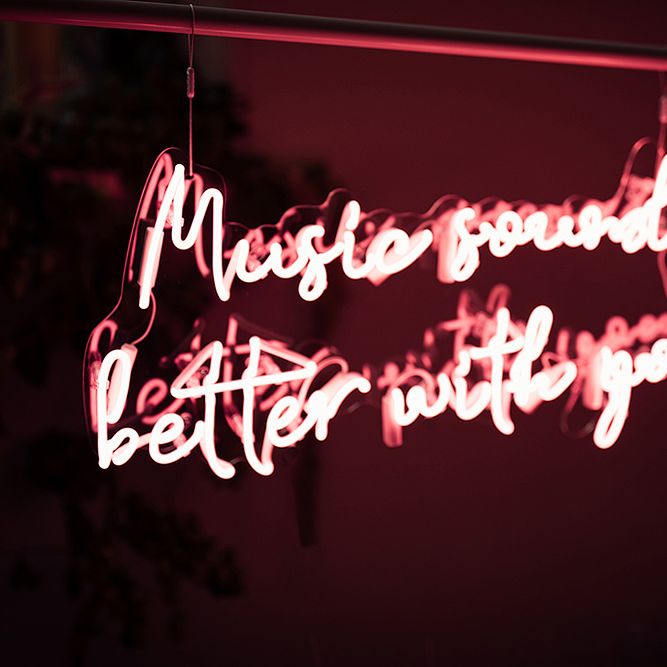 Pink Neon 'Music Sounds Better With You' Sign