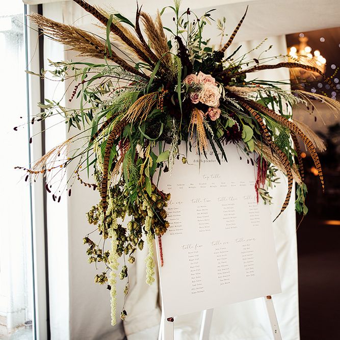 Table Plan with Floral Arrangement including Pampas Grass, Pheasant Feathers, Foliage and Red Flowers