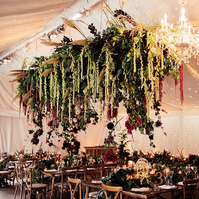 Hanging Floral Installation including Pampas Grass, Pheasant Feathers, Foliage and Red Flowers